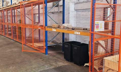 Pallet racking fitted with mesh doors to bays