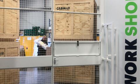 Large double door with logo to workshop