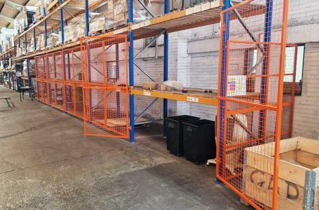 Pallet racking fitted with mesh doors to bays