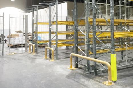 Newly installed pallet racking with end-of-rack protection anti-collapse and upright guards